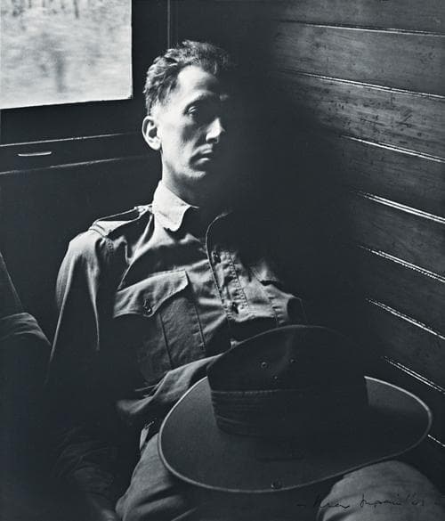 TIRED SOLDIER IN QUEENSLAND TRAIN