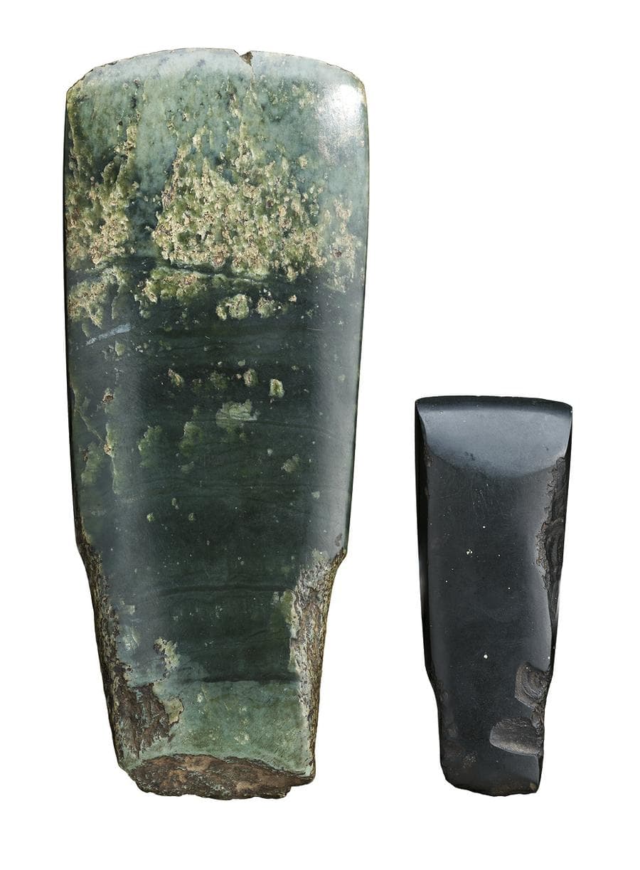 the larger New Zealand nephrite (greenstone), the smaller of black basalt