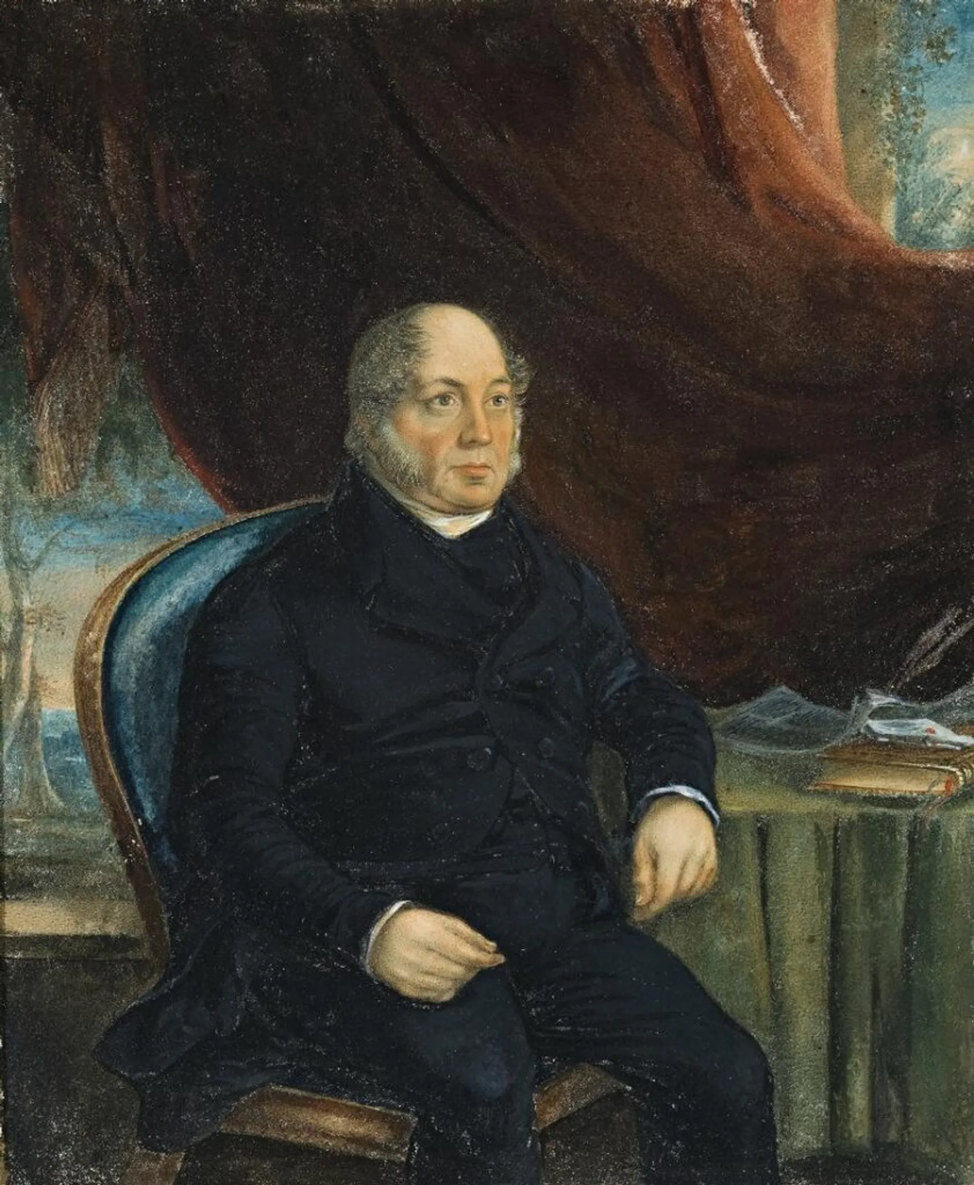WILLIAM WATCHORN SEATED IN HIS STUDY