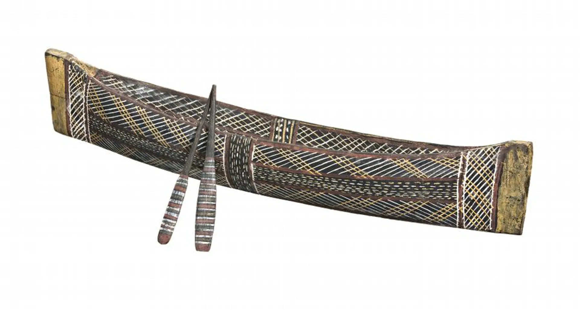 A MINIATURE CANOE AND PADDLES