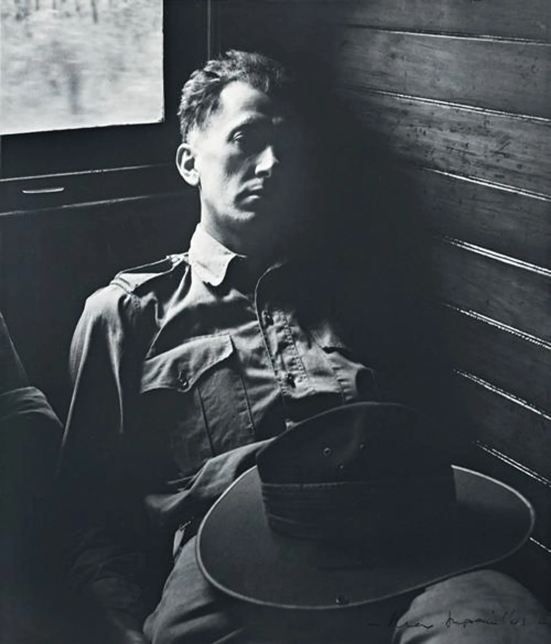 TIRED SOLDIER IN QUEENSLAND TRAIN