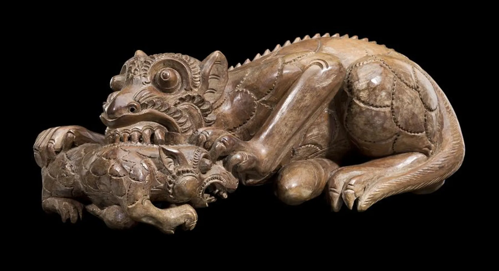 FIGURE OF A TIGER BITING ITS CUB