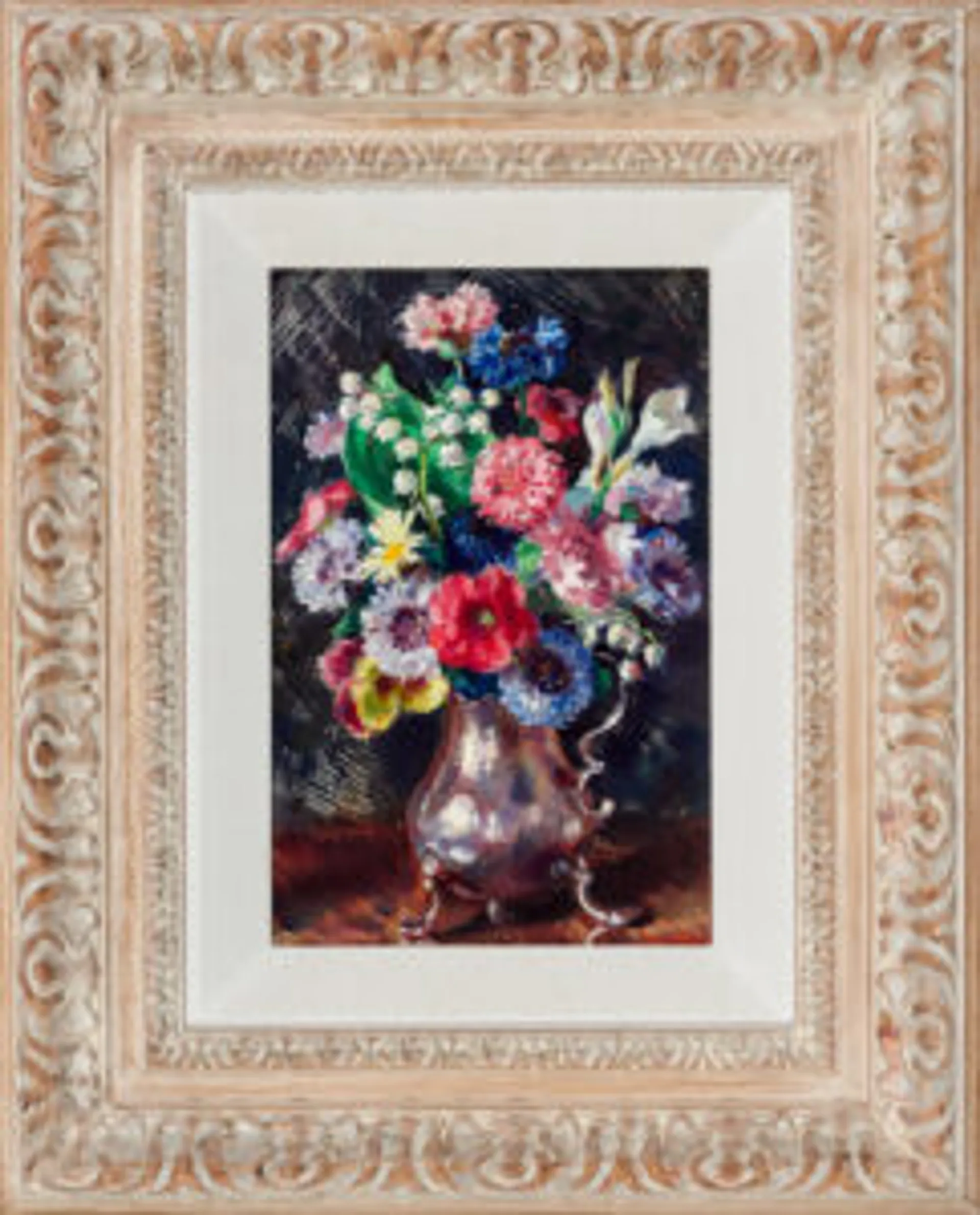 Mixed flowers in a silver jug
